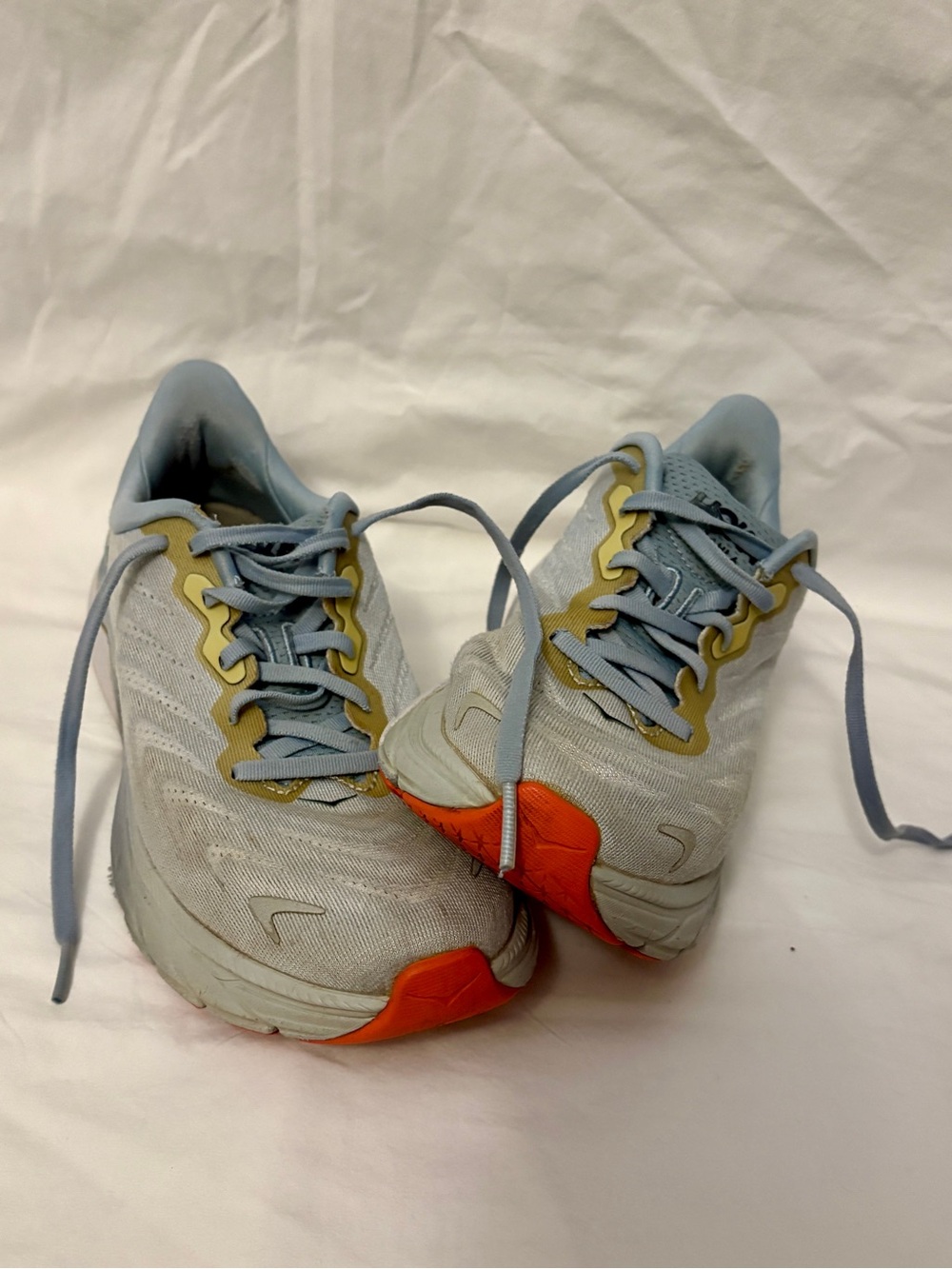 Hoka Women's Pale Blue Athletic Shoes with Orange Accents